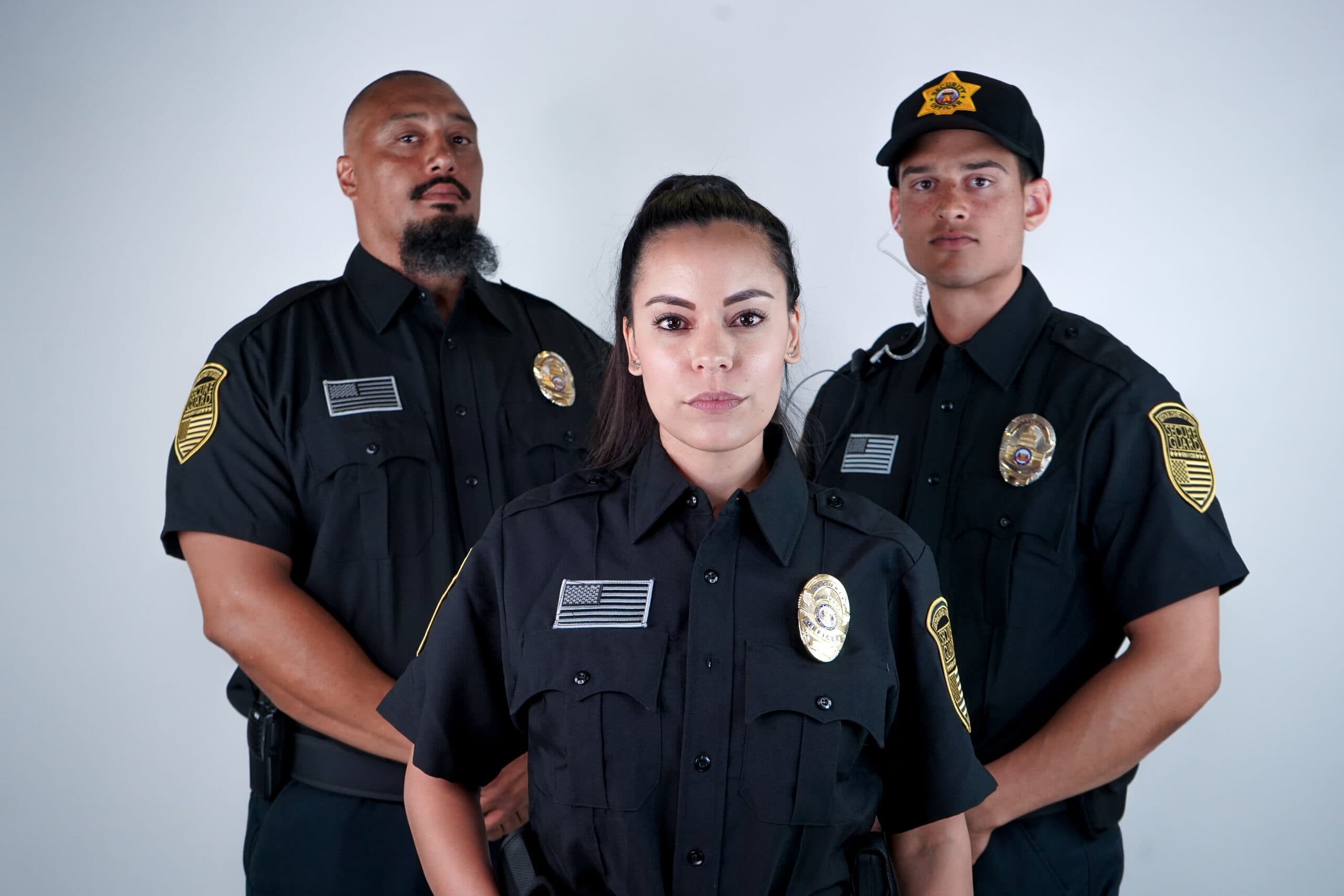 A team of professional security guards standing confidently in uniform, representing trust, safety, and reliable protection services.