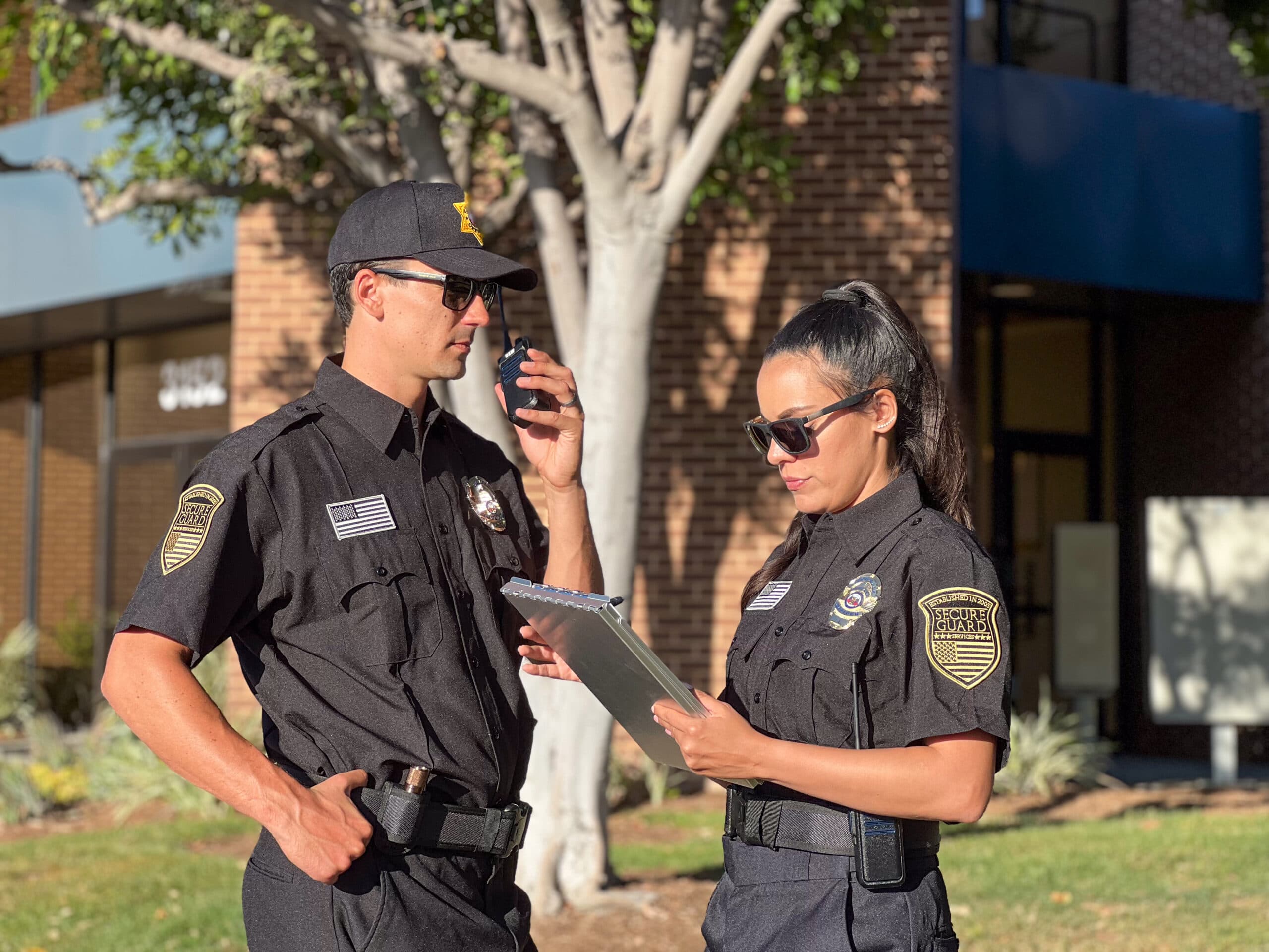 Professional security guards on duty at a gated community in San Diego, ensuring safety and monitoring property access.
