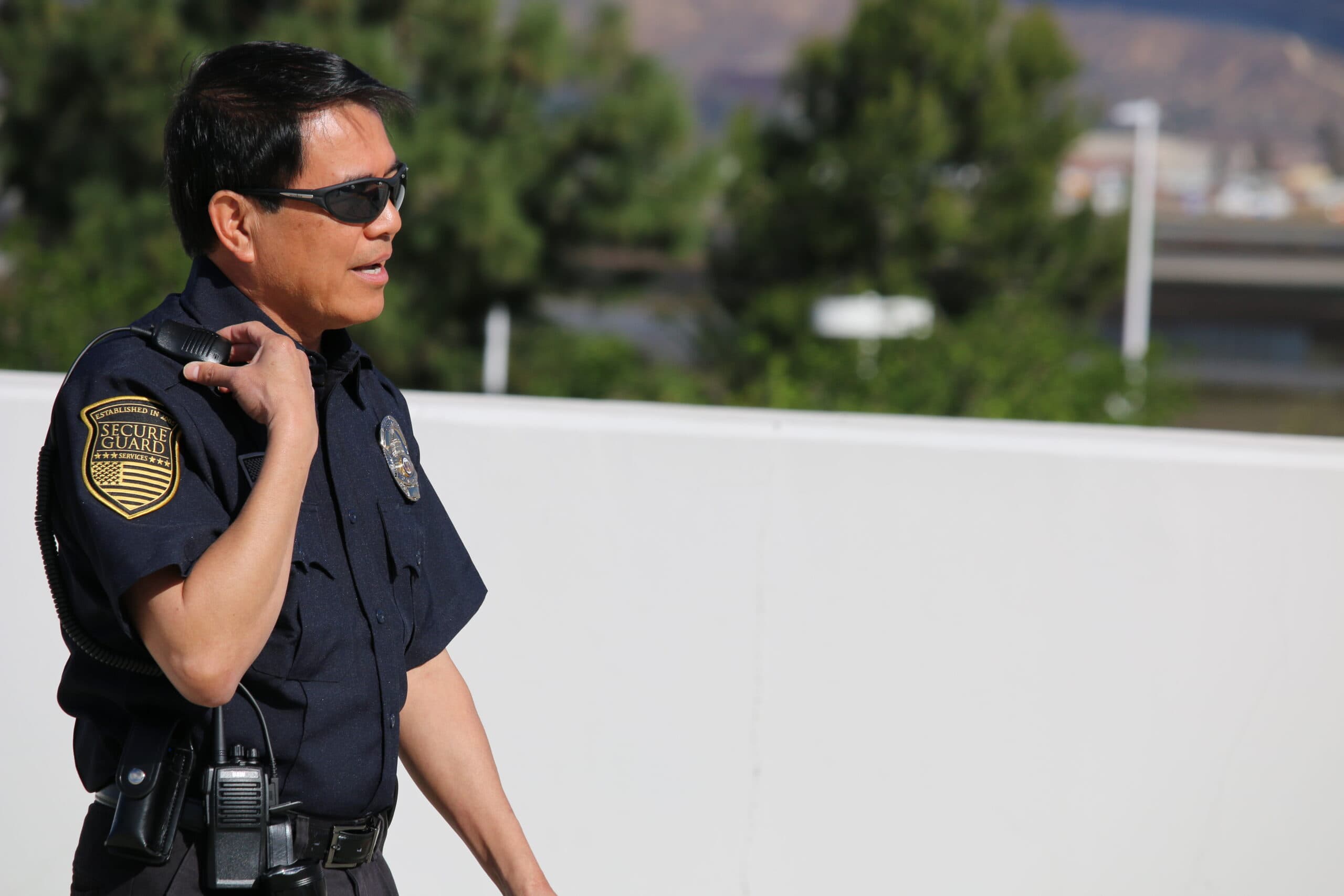 Campus security officer on patrol ensuring student safety at a California college campus.