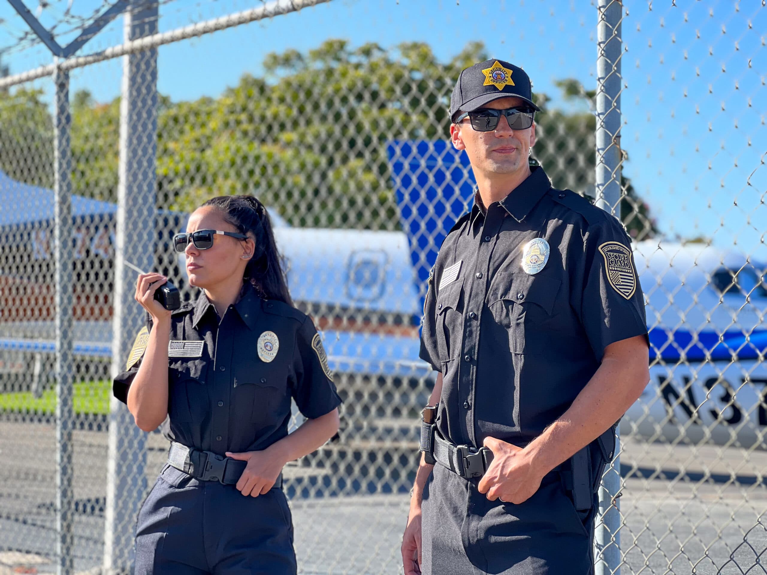 Professional onsite security guards in Los Angeles conducting perimeter monitoring at a secured facility, demonstrating licensed uniformed security services for commercial and industrial properties.
