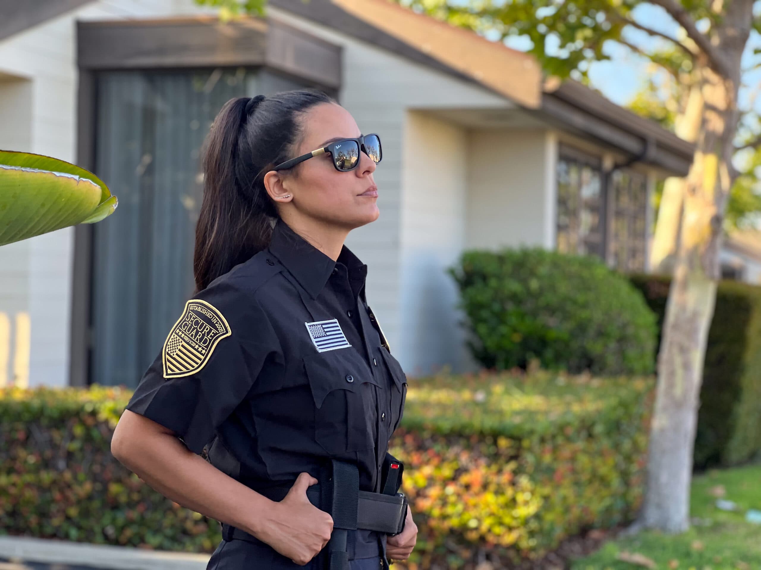 Professional security guard patrolling a residential neighborhood, providing security services for gated communities and homes in San Bernardino