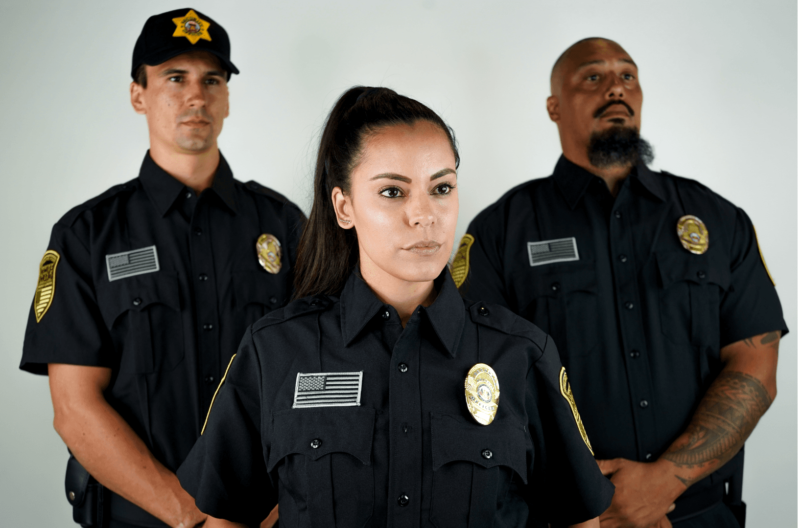 Three professional security guards standing together in uniform, representing reliable security guard company services for businesses and properties in San Francisco.